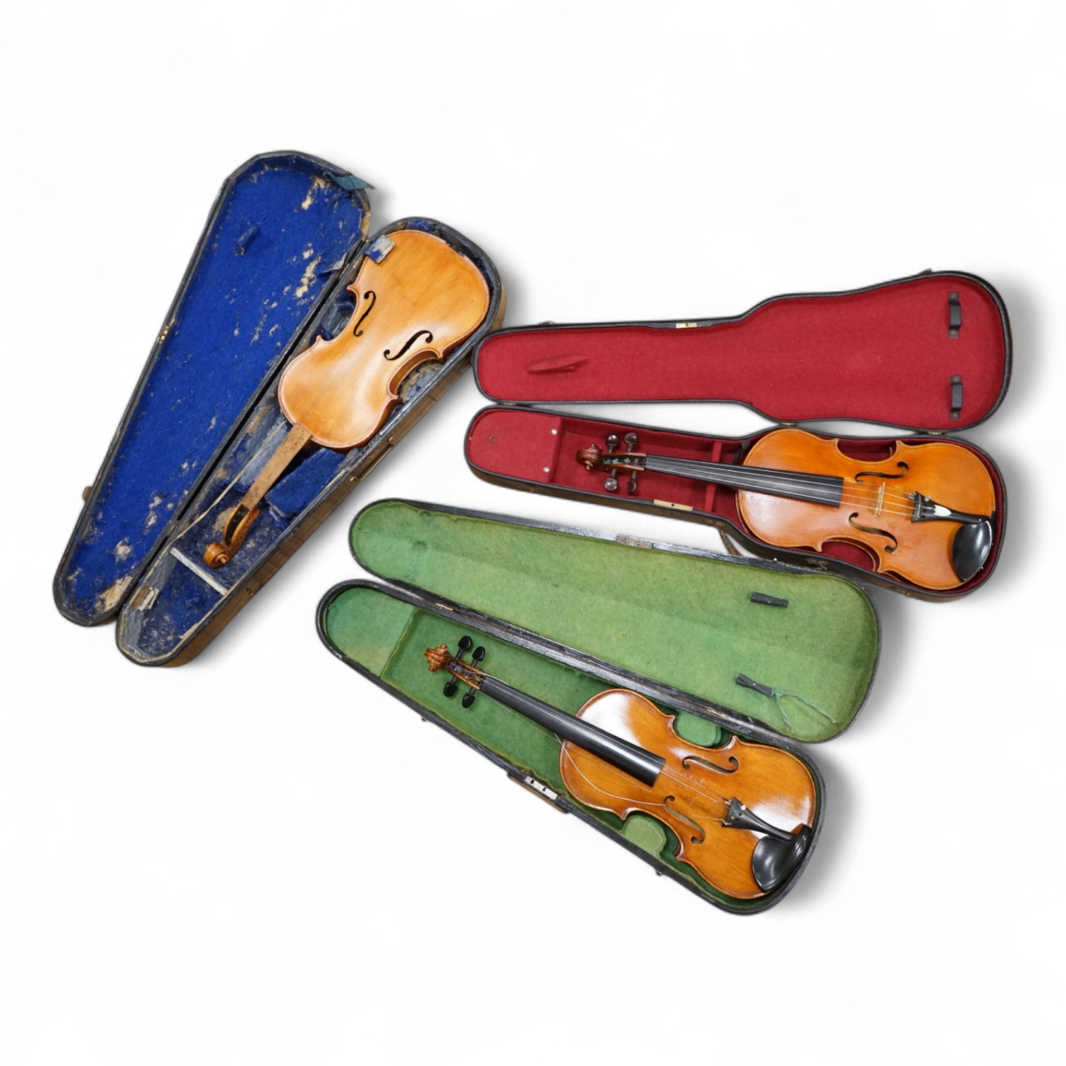 Three violins; a late 19th century German Stradivarius pattern violin, without label, a handmade violin (a.f.), with sound post crack, broken and repaired scroll, etc. and a Maidstone violin body, varnish stripped from t